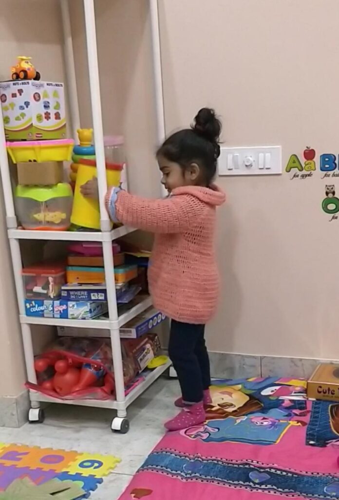 kid arranging toys maintaining personal hygiene