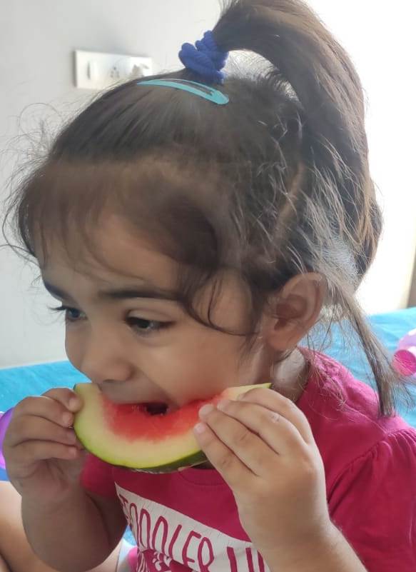 baby eating water melon