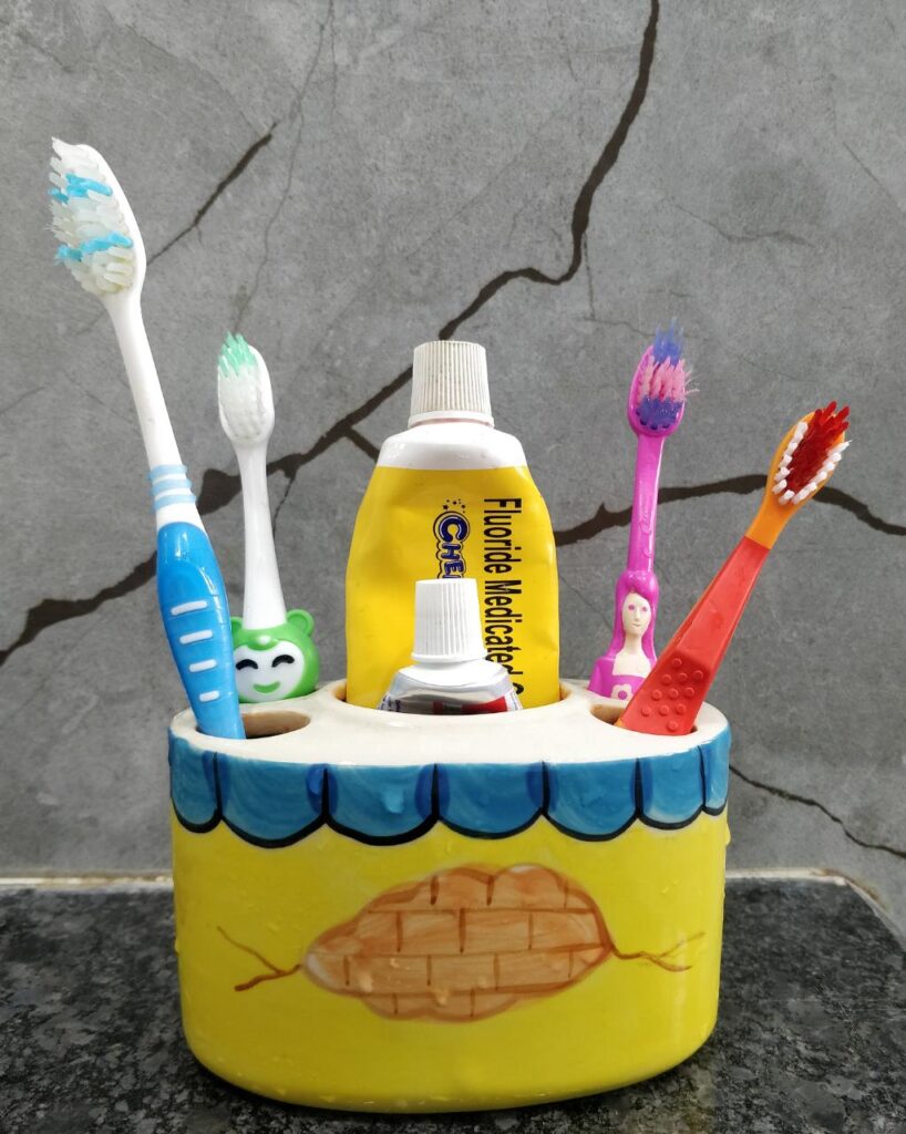 tooth brushes in a brush stand